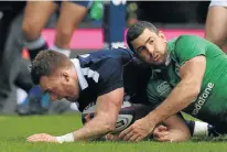  ?? Picture: AFP ?? TOUCHDOWN: Scotland fullback Stuart Hogg scores their first try during the Six Nations match against Ireland at Murrayfiel­d