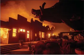  ?? NOAH BERGER — THE ASSOCIATED PRESS FILE ?? Flames from the Kincade Fire consume Soda Rock Winery in Healdsburg.