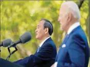  ?? PTI ?? Japanese Prime Minister Yoshihide Suga, and President Joe Biden speak at a news conference in the Rose Garden of the White House.