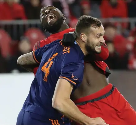  ?? STEVE RUSSELL/TORONTO STAR ?? In a testy first half in which the teams combined for 19 (!) fouls, TFC scoring hero Jozy Altidore took a hit from New York City’s Maxime Chanot.