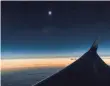  ??  ?? A special Alaska Airlines flight caught the eclipse over the Pacific.