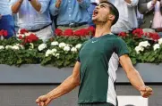  ?? PAUL WHITE/ASSOCIATED PRESS ?? Carlos Alcaraz, of Spain, celebrates after winning the final match against Alexander Zverev, of Germany, at the Mutua Madrid Open tennis tournament in Madrid, Spain, Sunday.