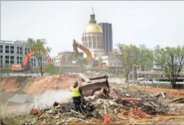  ?? David Goldman / The Associated Press ?? A $49 billion budget approved by the General Assembly includes $105 million to finance constructi­on of a new judicial complex at the former site of the Georgia Archives building which was imploded recently to make way.