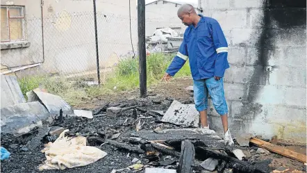 ?? Picture: ANDISA BONANI ?? DEVASTATIO­N LEFT BEHIND: The gutted remains of the shack where Akhona Bilatye is said to have died
