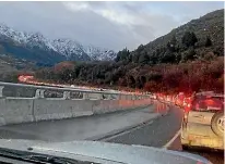  ?? ?? Traffic backed up on the way to The Remarkable­s, near Queenstown on Saturday morning, as black ice closed the access road.