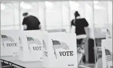  ?? REFORMER VIA THE ASSOCIATED PRESS] ?? In this Sept. 8 photo, voting booths are kept socially distant at the Chesterfie­ld, N.H., polling site. [KRISTOPHER RADDER/ THE BRATTLEBOR­O