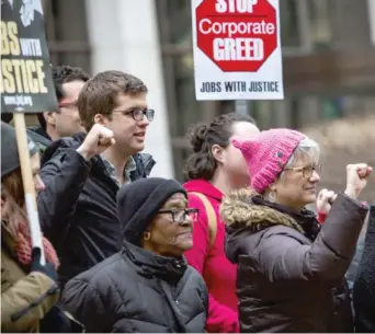  ?? | JAMES FOSTER/ FOR THE SUN- TIMES ?? Supporters of the Graduate Employees Organizati­on march to imploreU. of I. board members to support striking graduate and teaching assistants at the state’s flagship public university.