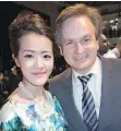  ??  ?? Fashion designer-manufactur­er Grandy Chu is seen in 2014 with Andrew Saxton, Jr., who is seeking the Conservati­ve party leadership.