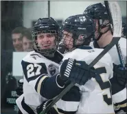  ?? JAMES BEAVER/FOR MEDIANEWS GROUP ?? Keenan Schneider (27) celebrates with Jake Hannon (5) after Hannon scores against Roman Catholic on Thursday night.