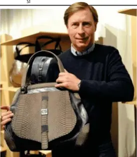  ??  ?? Fashion: Guccio Gucci with one of his ToBeG designer bags