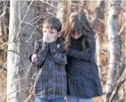  ??  ?? HORRIFIED: Families were devastated by the Sandy Hook deaths.