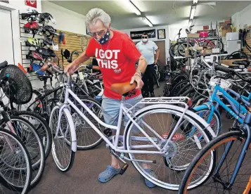  ?? [FRED SQUILLANTE/DISPATCH] ?? Dandy Bikes owner Gary Stivers says his Clintonvil­le store has fewer new and refurbishe­d bikes on the sales floor than usual because of high demand and reduced supply, and he also has far more bikes than usual awaiting repairs.