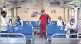  ?? (Photo: Bhushan Koyande) ?? Health workers sanitise a local train coach at CSMT on Wednesday