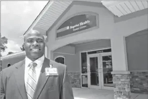  ?? RUSTY HUBBARD/TRI-LAKES EDITION ?? Greg Stubblefie­ld, vice president/administra­tor of Baptist Health in Arkadelphi­a, stands in front of the new space for the Baptist Health Family Clinic in the new Gathright Medical Plaza.