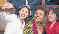  ?? J. SCOTT APPLEWHITE THE ASSOCIATED PRESS ?? Democrat Alexandria Ocasio-Cortez, left, from New York, takes a picture with members Ann Kuster and Barbara Lee.