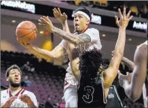  ?? Patrick Connolly Las Vegas Review-journal @Pconnpie ?? New Mexico State Aggies guard Zach Lofton takes the ball up for a shot in Thursdays WAC quarterfin­al win, 97-70, at Orleans Arena.
