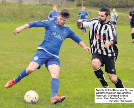  ??  ?? Tumble United Reserves’ Tyrone Williams moves in on Llandeilo Reserves’ Brandon Florence during their Darch Cup tie.Pictures: Phil Davies