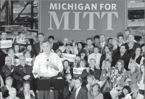  ?? By Gerald Herbert, AP ?? Riding on father’s name: Former Massachuse­tts governor Mitt Romney campaigns in Kentwood, Mich., on Wednesday. Both candidates’ views on the auto industry bailout could make things bumpy.