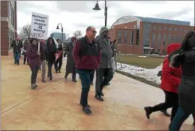  ?? LISA MITCHELL — DIGITAL FIRST MEDIA ?? Kutztown University President Kenneth Hawkinson and Dr. Warren Hilton, vice president for enrollment management and student affairs, center, joined in the Kutztown Resist Solidarity March on campus Feb. 16.