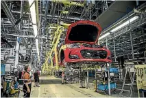  ??  ?? The final red VF Commodore on the line at the plant.