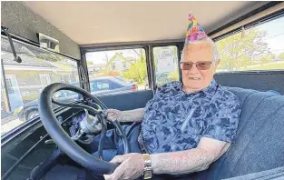  ?? TINA COMEAU ?? Yarmouth resident George Atkins sits inside a 1927 Model T Ford on his 96th birthday. Some family and friends made it a special day for the Second World War veteran, including asking some antique auto car owners to do a drive-by.