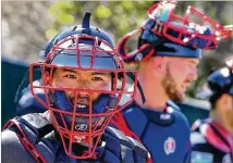  ?? CURTIS COMPTON / CCOMPTON@AJC.COM ?? Braves catchers Kurt Suzuki (left) and Tyler Flowers work in the pen at practice Saturday at the ESPN Wide World of Sports Complex in Lake Buena Vista, Fla.