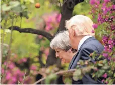  ?? JONATHAN ERNST, AP ?? President Trump talks to British Prime Minister Theresa May at the G-7 Summit in Taormina, Sicily, Italy, last month.