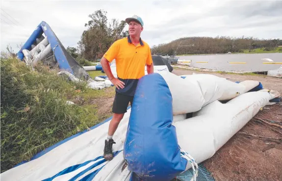  ?? Pictures: Glenn Hampson ?? Gold Coast Wake Park owner Daniel Watkins and staff cleaning up so they can reopen on the weekend.