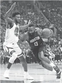  ?? TROY TAORMINA/USA TODAY SPORTS ?? Rockets guard James Harden (13) drives to the basket around Warriors center Jordan Bell (2).