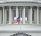  ?? PATRICK SEMANSKY/AP ?? An American flag flies at half-staff in remembranc­e of U.S. Capitol Police Officer Brian Sicknick in Washington, D.C., on Friday.