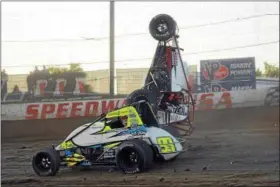  ?? RICK KEPNER - FOR DIGITAL FIRST MEDIA ?? Eric Daum goes airborne as Brady Bacon speeds past during a preliminar­y of the USAC AMSOIL National Sprint Car Series races at Grandview Speedway on June 14.