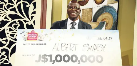  ?? CONTRIBUTE­D ?? Albert Swaby is all smiles as he poses with the cheque signalling he is now part of the VM Million Dollar Winners Club.