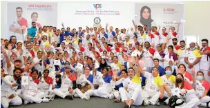  ?? ?? Nurses from VPS Healthcare share a light moment after setting two Guinness World Records at Burjeel Medical City.