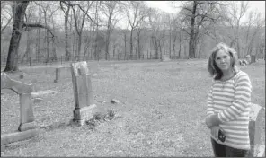  ?? Special to the Democrat-Gazette ?? Lois Willard, a member of the Shaddox Cemetery Associatio­n, stands near Civil War-era graves at the cemetery in Newton County. The fence the associatio­n installed to keep elk out can be seen in the background.