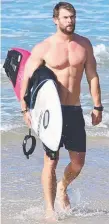  ??  ?? Chris Hemsworth surfing at Byron Bay. Picture: GETTY