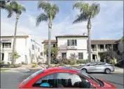  ?? Myung J. Chun Los Angeles Times ?? THE BILL would have eliminated parking minimums in areas approved for the multi-unit buildings.