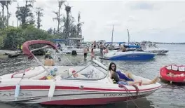  ?? RICK TAYLOR ?? Boaters beat the summer heat at Bird Island in this undated photo by Rick Taylor, who manages a Facebook page.