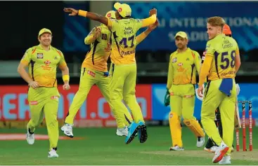  ??  ?? Chennai Super Kings’ players celebrate the run-out dismissal of Sunrisers Hyderabad’s Manish Pandey in Dubai, UAE, on Tuesday