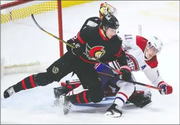  ?? CP PHOTO SEAN KILPATRICK ?? Ottawa Senators defenceman Nikita Zaitsev (22) checks Montreal Canadiens right wing Brendan Gallagher (11) during third period NHL action in Ottawa on Tuesday.