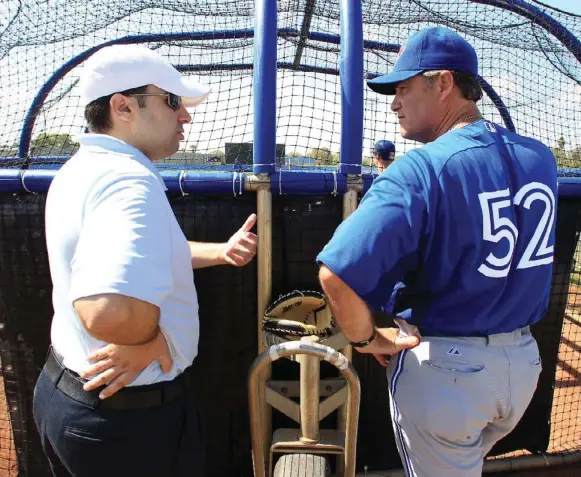  ?? RENÉ JOHNSTON/TORONTO STAR ?? Some key pieces may still be in the minors but GM Alex Anthopoulo­s, left, and manager John Farrell lead a Jays team that has a chance to win if everything goes right this season.