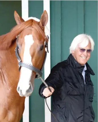  ?? GETTY IMAGES ?? Trainer Bob Baffert, walking Justify to the barn, is 4- 0 with Derby winners in the Preakness.