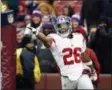  ?? PATRICK SEMANSKY - THE ASSOCIATED PRESS ?? New York Giants running back Saquon Barkley (26) celebrates his 78-yard touchdown during the first half of an NFL football game against the Washington Redskins, Sunday, Dec. 9, 2018, in Landover, Md.