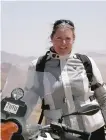  ?? ALISA CLICKENGER/AP ?? Clickenger posing with her motorcycle in Namibia.