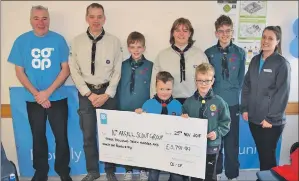  ?? 50_c49coop02 ?? Scout leaders Alistair and Lindsay Kenny brought along some scouts to receive their cheque.