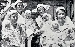  ?? PHOTO: SIR GEORGE GREY SPECIAL COLLECTION­S, AUCKLAND LIBRARIES, AWNS-19360205-45-3 ?? The Johnson Quads, photograph­ed with nurses from Dunedin’s Truby King-Harris Karitane Hospital, where they stayed for 10-and-a-half months after their birth.
