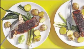  ?? [TOM MCCORKLE/FOR THE WASHINGTON POST; FOOD STYLING BY LISA CHERKASKY/ ?? Brown sugar-and-chili-rubbed salmon sheet-pan dinner