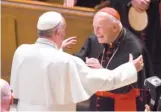  ?? JONATHAN NEWTON/THE WASHINGTON POST VIA AP FILES ?? Pope Francis reaches out in 2015 to hug former Cardinal Theodore McCarrick in Washington, D.C.