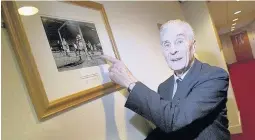  ??  ?? Hoopy memories Davie Laing looks over pictures of the famous win over Celtic at Hampden
