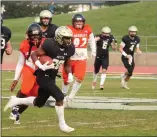  ?? RICK SILVA — PARADISE POST ?? Butte College running back Caleb Ramseur breaks off a long run in a Gridiron Bowl win over Reedley College on Dec. 4, 2021, at Butte College.