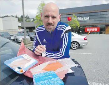  ?? JASON PAYNE ?? Regan McEachnie was among those recruited to collect fish samples for analysis. Preliminar­y results suggest that B.C. retailers are more prone to poor labelling practices than stores in other parts of Canada.